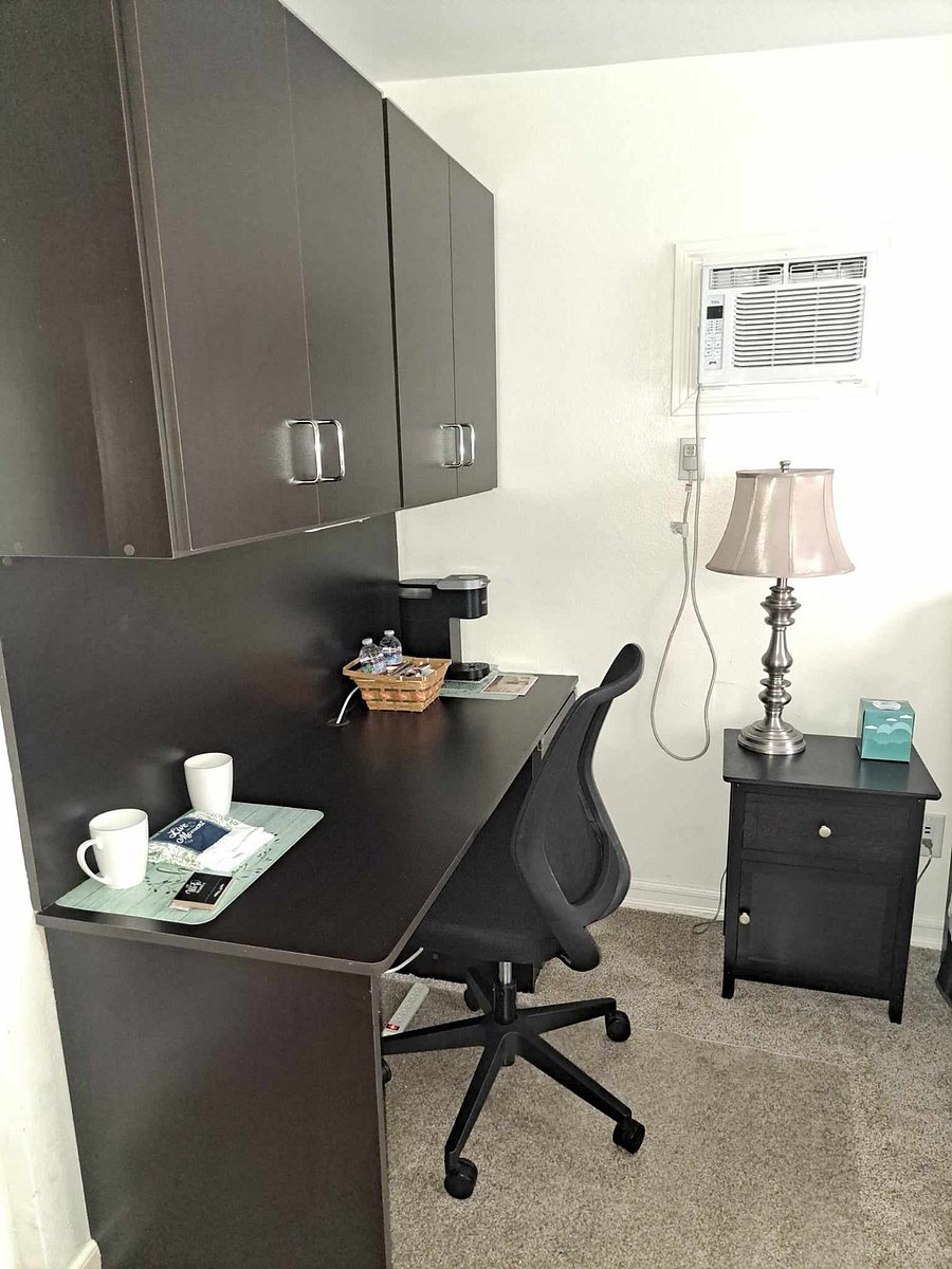 Can be used as a table and has a lot of storage space above desk.