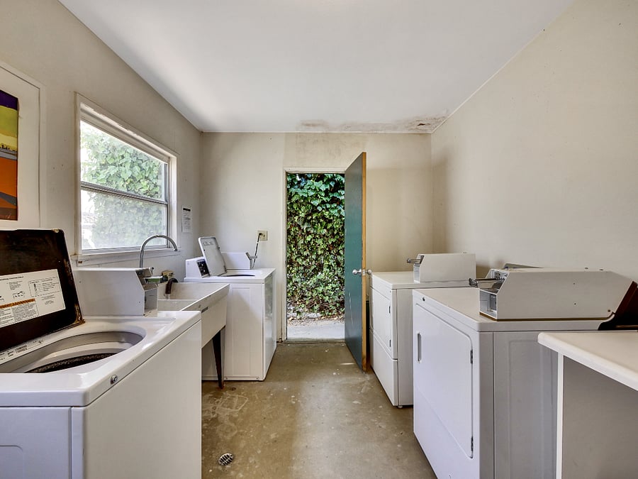 Laundry room with large folding table to fold your clothes easily sink to do your hand wash natural light two washes two dryers storage for laundry soaps, clotheslines outside to naturally dry your clothes in the sun just like youre in Europe! 