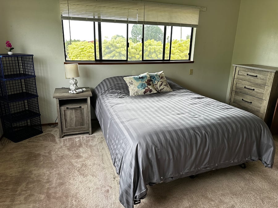 Comfortable primary bedroom with queen bed and full bathroom