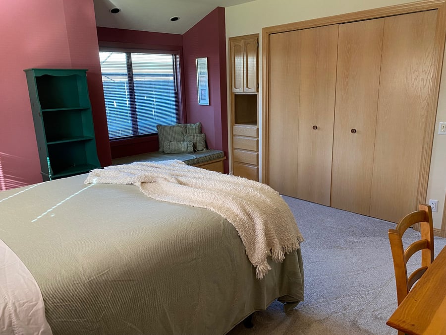 Window seat, built-in dresser, and closet with cedar floor and organizer.