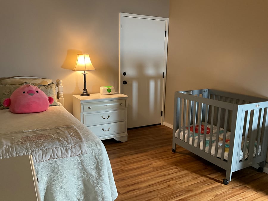 Bedroom #2 with attached bath and optional baby crib. Single bed is adjustable at head and feet.