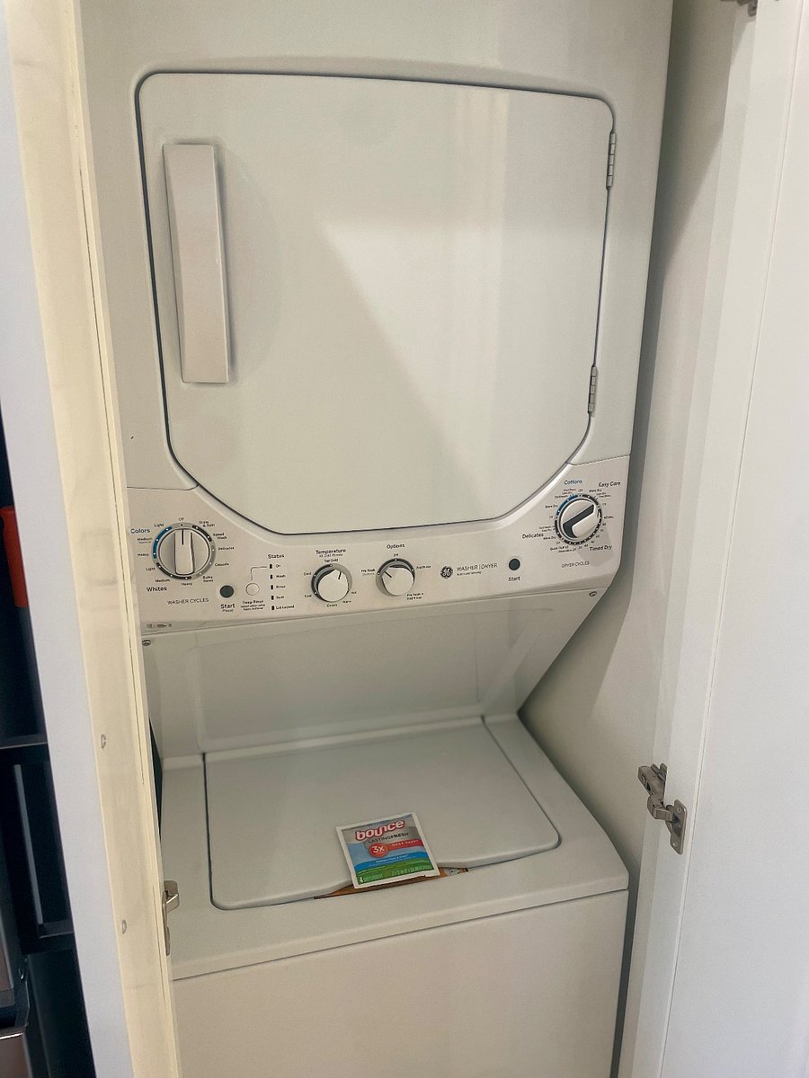 Brand new stacked washer and dryer