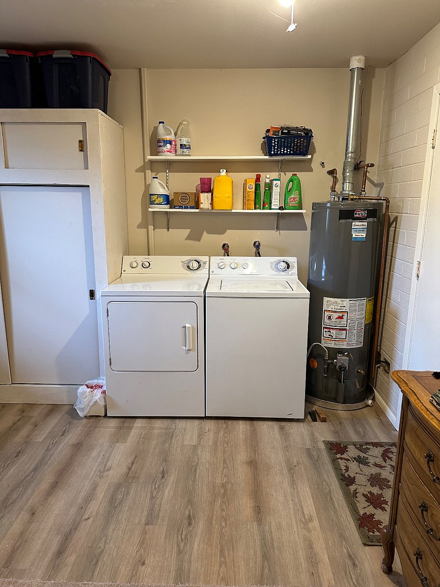 Washer and drier in laundry room off garage