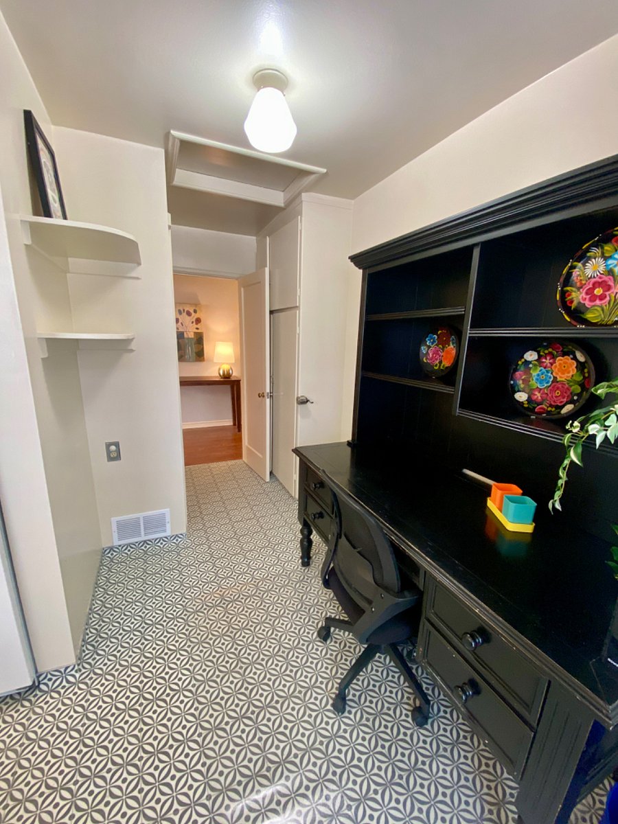 View into the hallway from the workspace off of the kitchen.