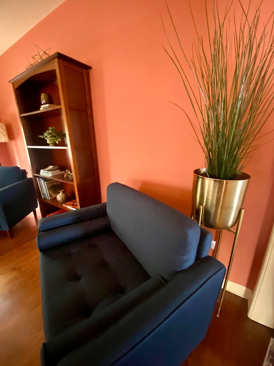 Mid-century style reading area in living room.