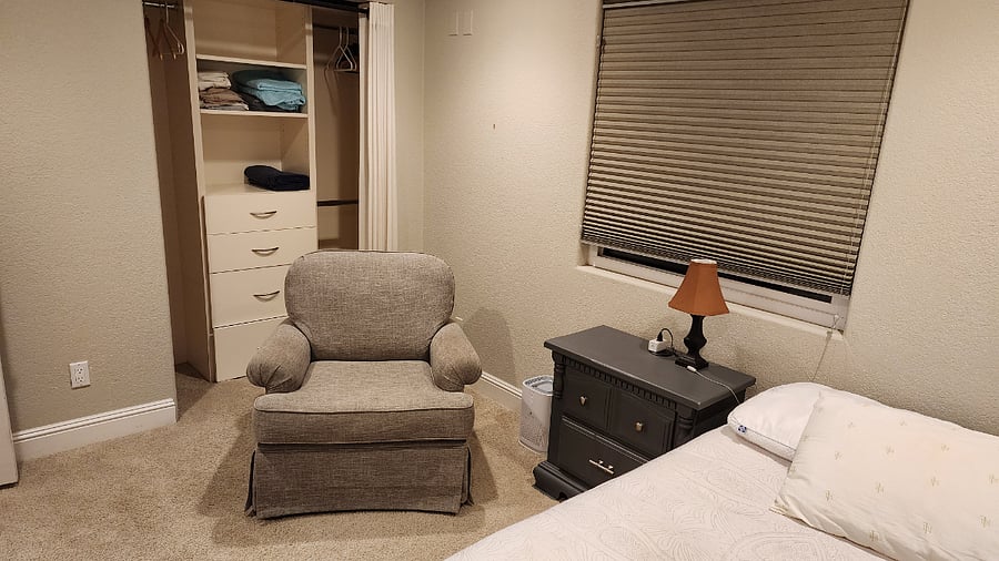 Bedroom #1 - Full Size Bed, Nightstand, Oversized Chair, and closet