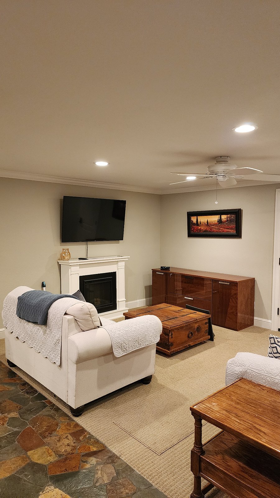 Living Room - 55" Smart TV, Electric Fireplace, and couches