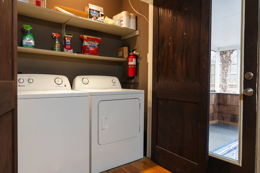 In unit washer and dryer with safety amenities and cleaning supply