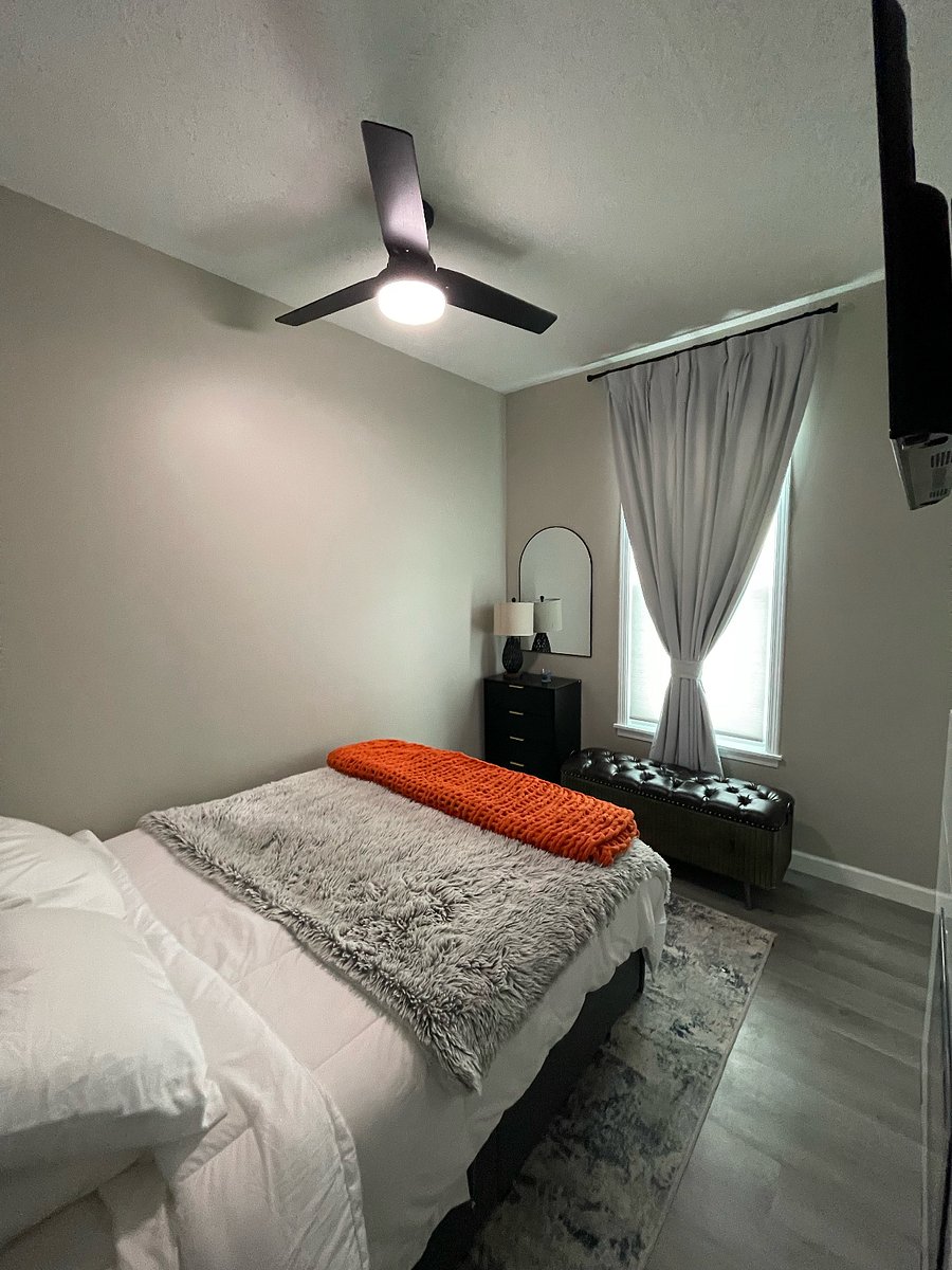 Bedroom - black-out drapes, LED fireplace w/ remote, touch-on lights w/ USB, dresser for clothes. Closet w/ suitcase rack. Bed also has extra comfy mattress w/ usb outlets in the headboard.