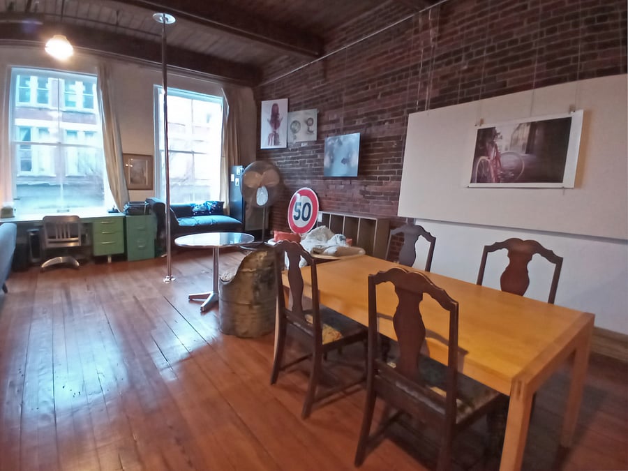 For larger gatherings, savor the dining space featuring a generous wooden table perfect for grand dinner parties.
