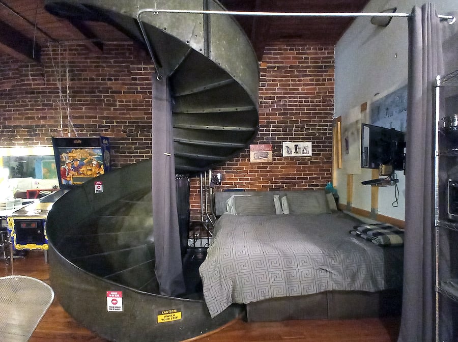 Voila, the master bedroom, featuring a spacious king-size bed. Enjoy the added convenience of shelving running alongside and behind the bed, providing ample storage and easy access to essentials.