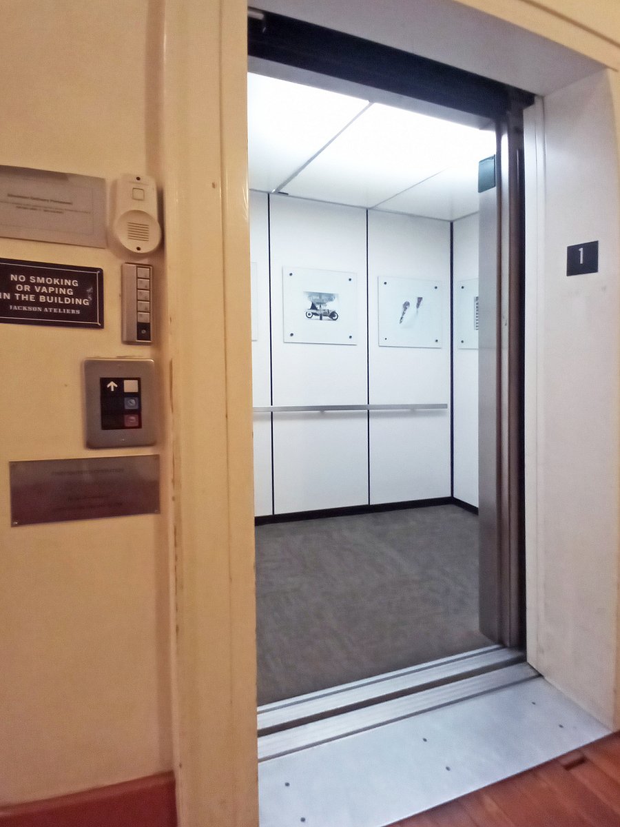 Finally a view of the building's secure elevator, protected by a passcode, featuring photography curated by your property manager.