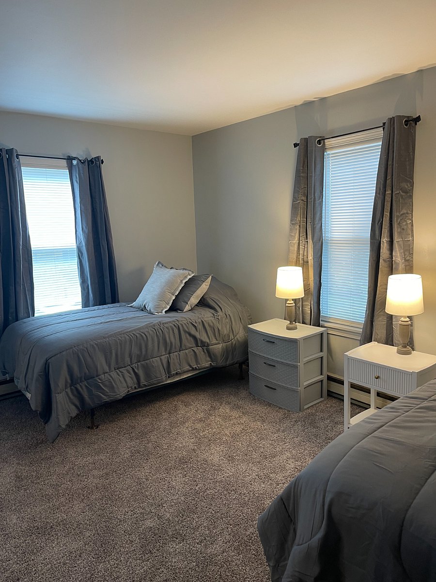2nd floor bedroom with two twin beds. Bathroom is on first floor. Spiral staircase