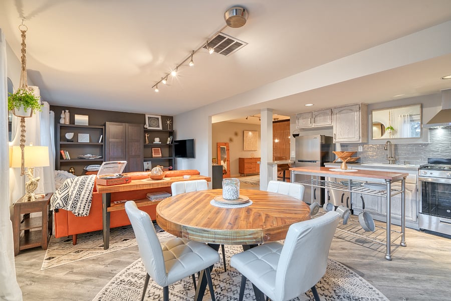 View from coffee/drink station (behind) into the dining and living area. Kitchen is just to the right.