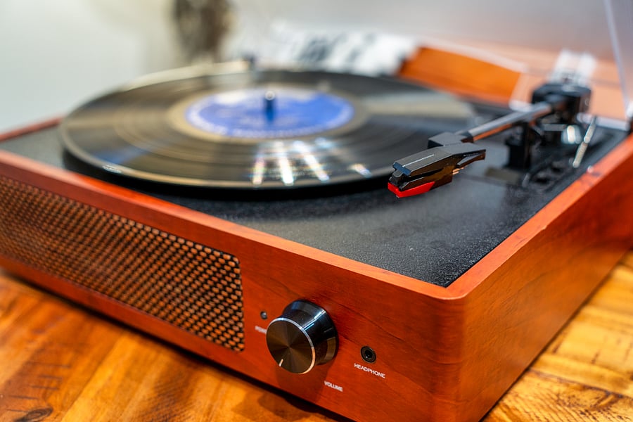 Record player with records. Also plays bluetooth from your phone.