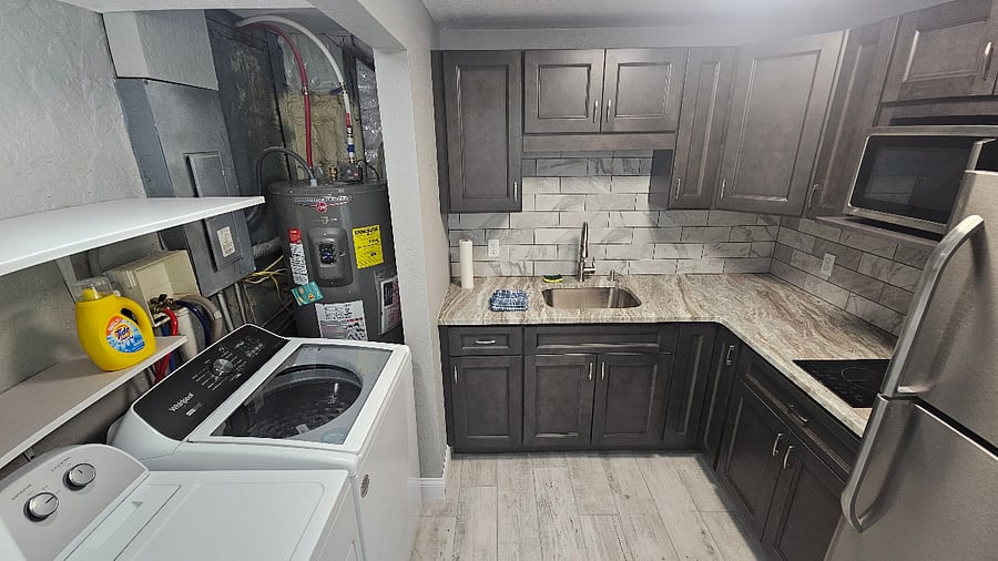 Downstairs laundry and second kitchen! Right at back porch overlooking lake.