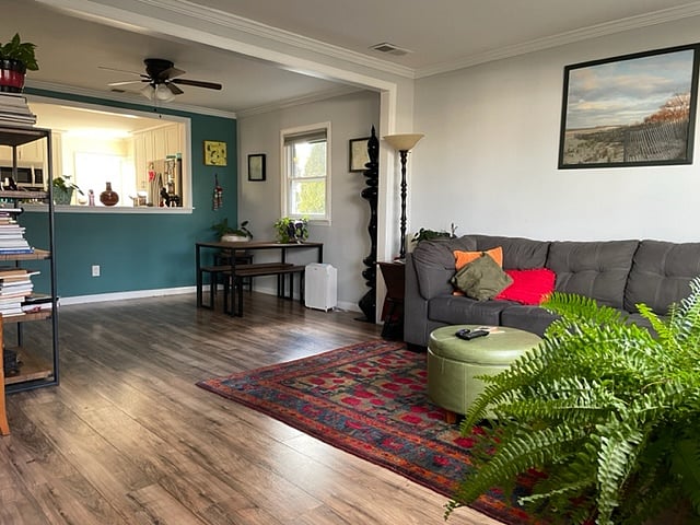 Cozy Living room with large TV and sectional and eating area 