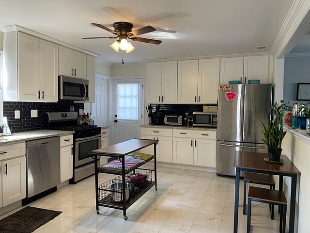 Large kitchen with all modern appliances and eating area. Laundry room off the area near side door