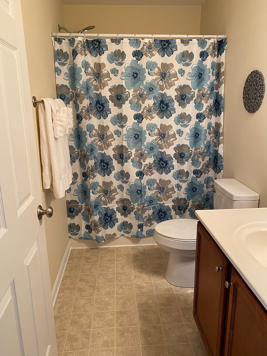 Bathroom in the hallway upstairs next to the second bedroom.