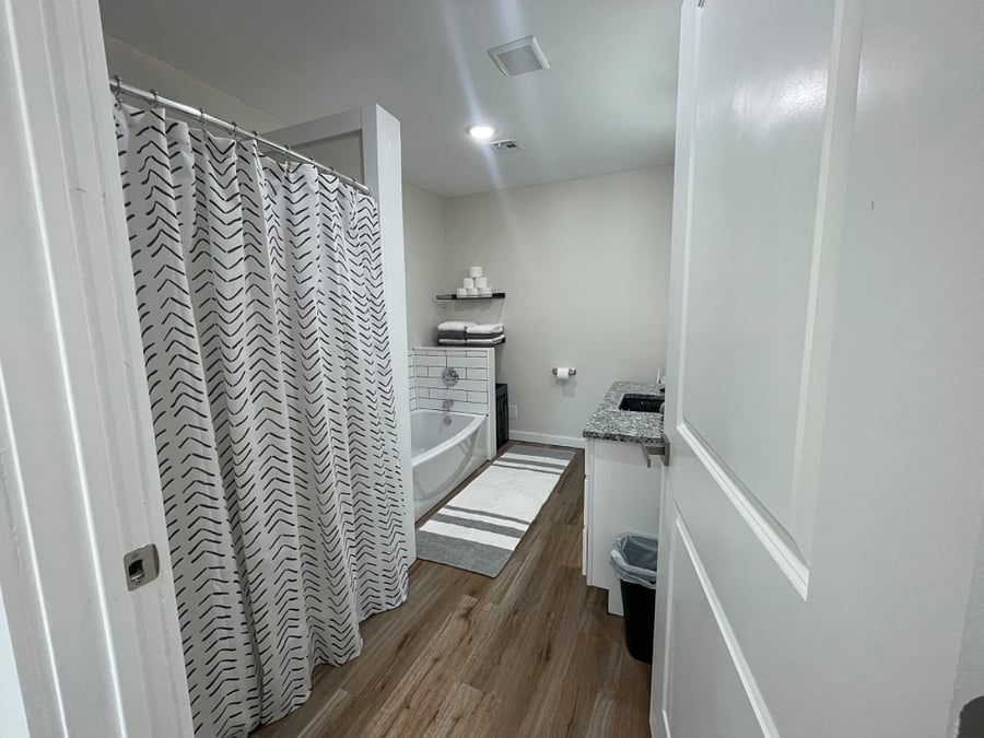 Main bathroom has a walk in shower and separate tub. 
