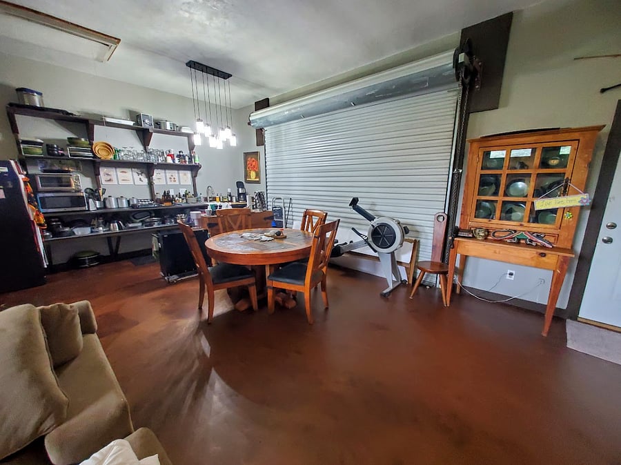 Dinning room and kitchen area, including a rowing machine