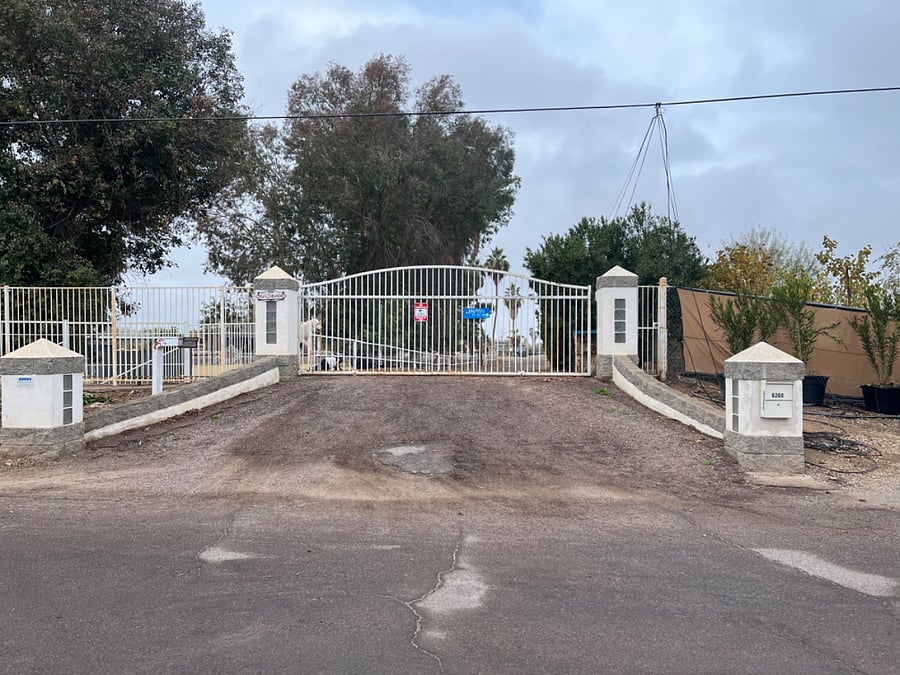 Front entrance with automatic gate for security, gate opens via cell phone app