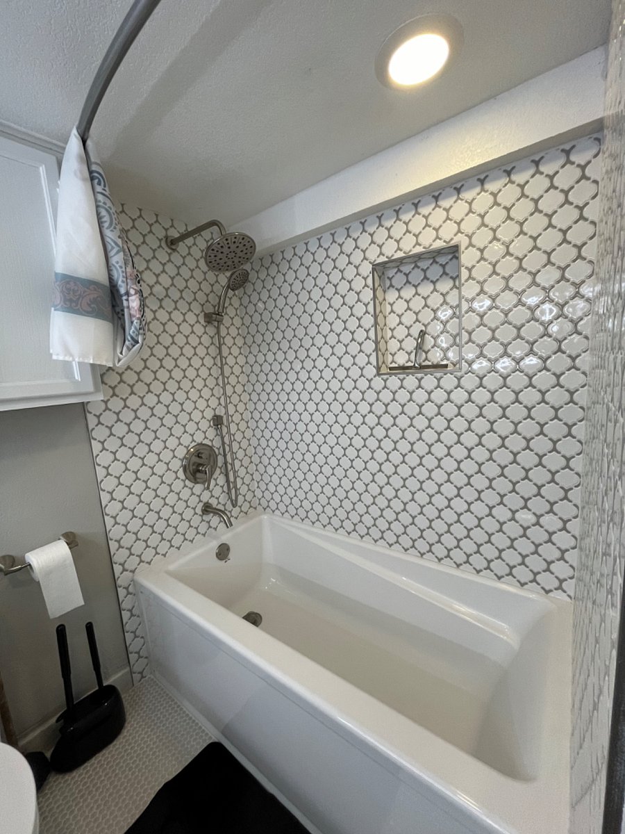 Full-sized tub with shower