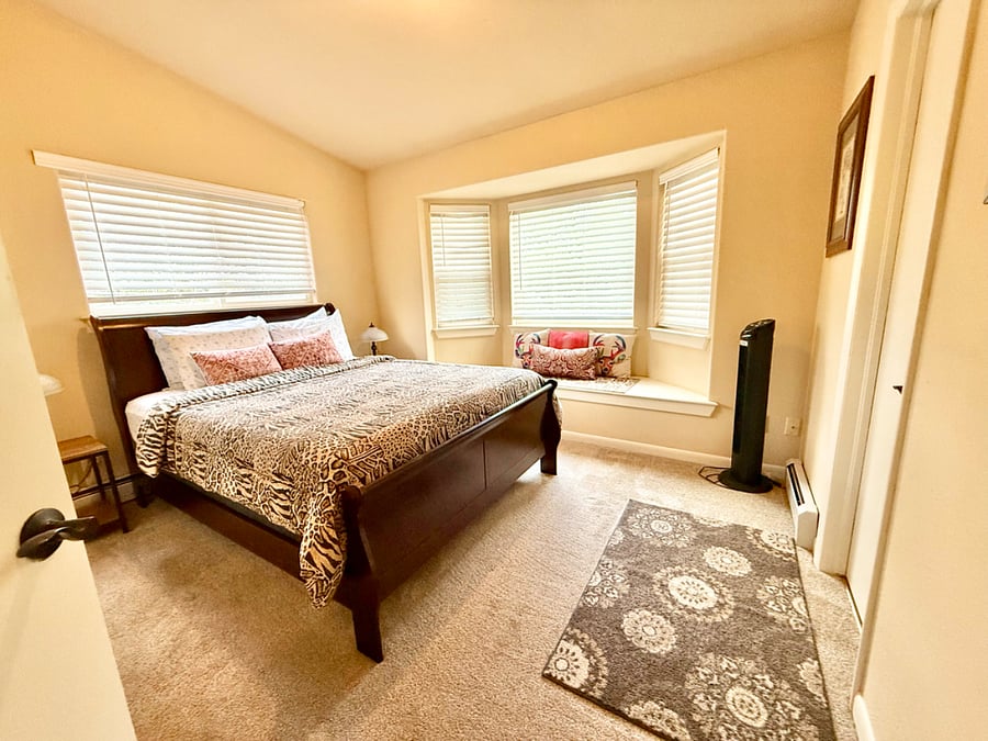 queen bedroom with bay window on top floor
