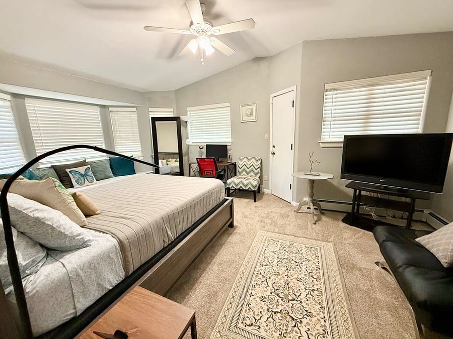 Master bedroom with a working station and private balcony