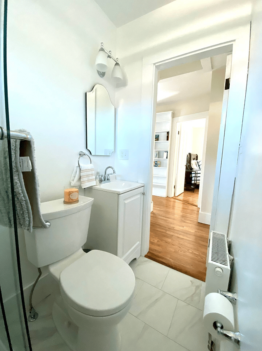 Upstairs hallway guest bathroom with a shower