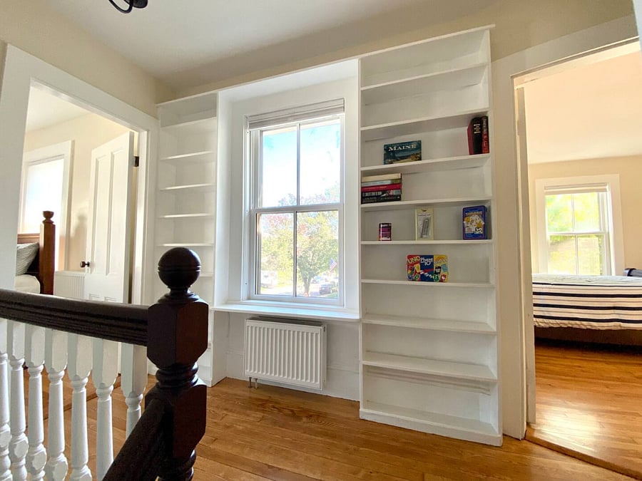 Staircase upstairs to three bedrooms and two bathrooms