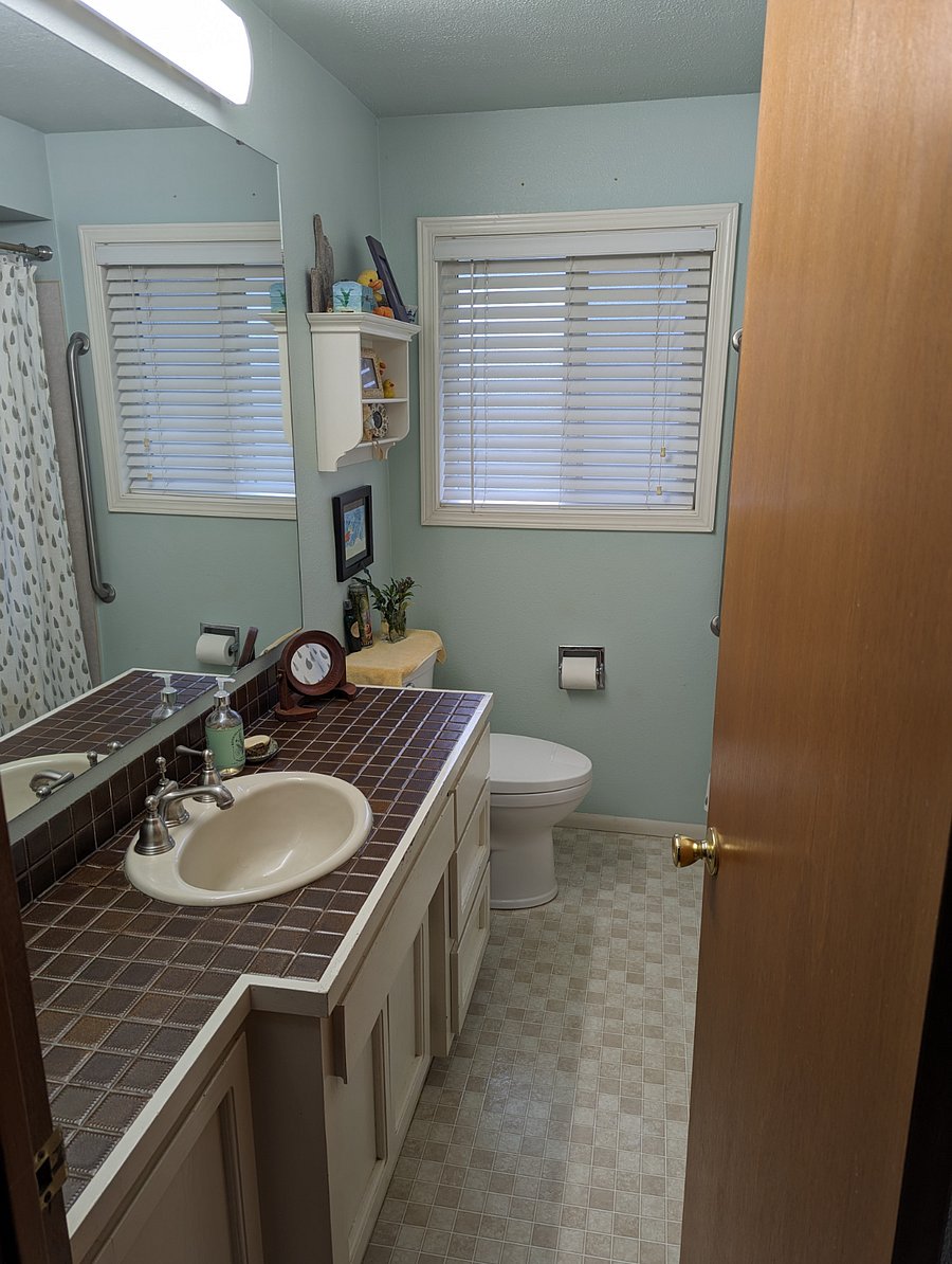Shared Bath and storage from entry way