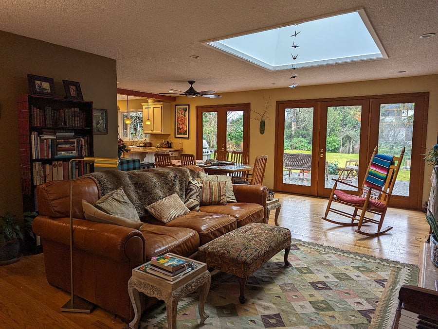 Living room with a view out to deck and yard.
