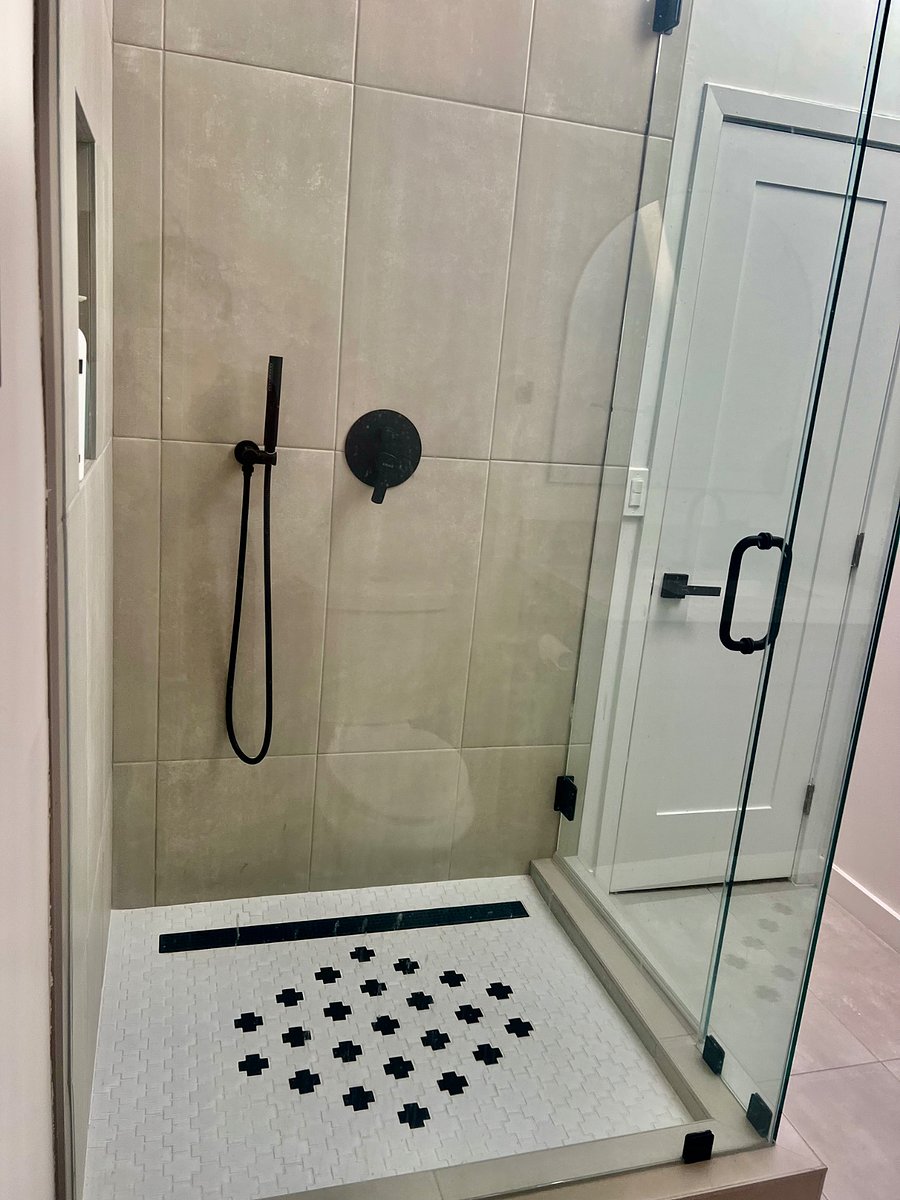 Oversized shower head with wand.
