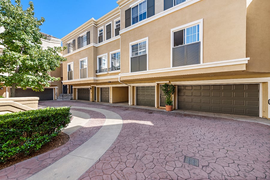 Single car garage next to carport.