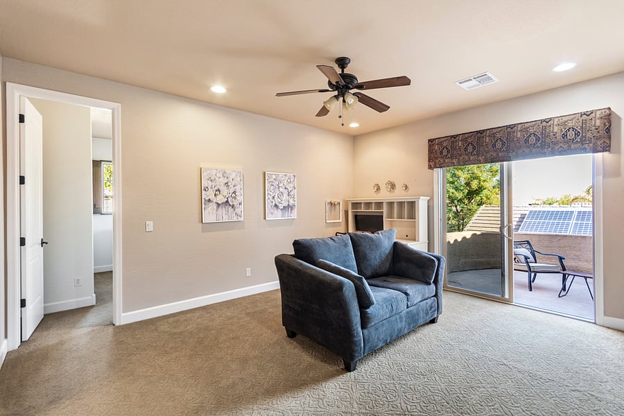desk is located behind the couch
