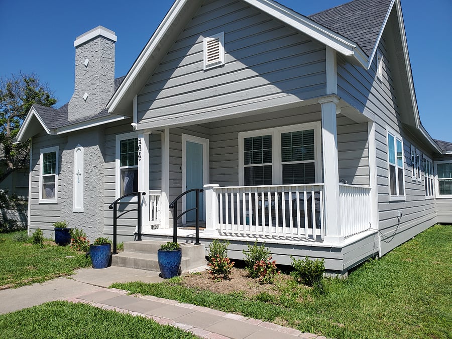 This is a picture of the main house where my husband and I live. The guest cottage is in the backyard. Access to the backyard is through a pedestrian gate by the driveway.