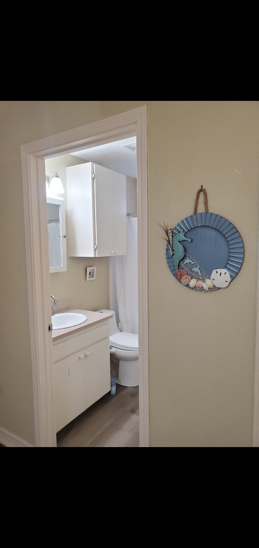 The bathroom is off the bedroom.