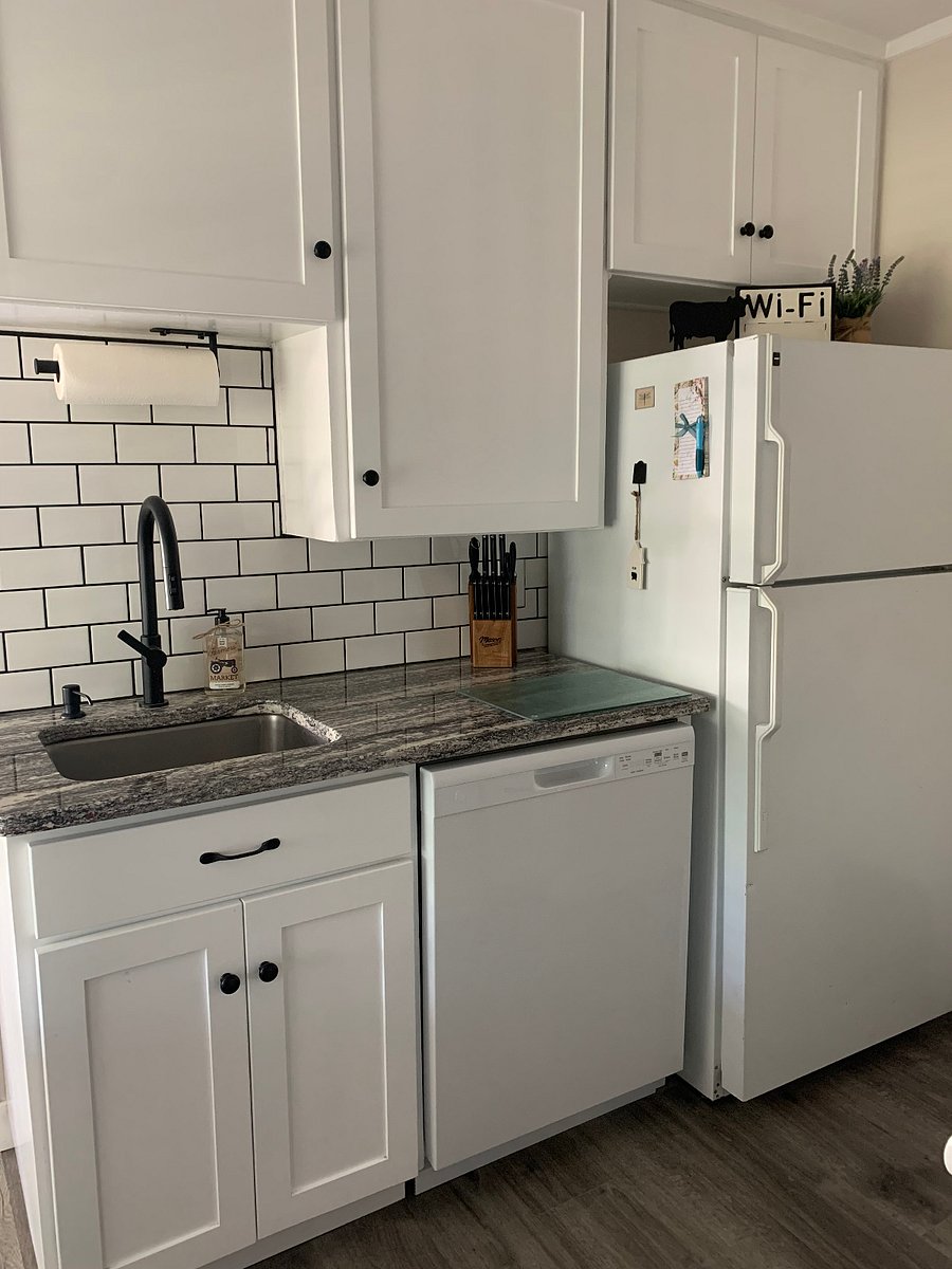Kitchen sink, countertop (granite), dishwasher and refrigerator