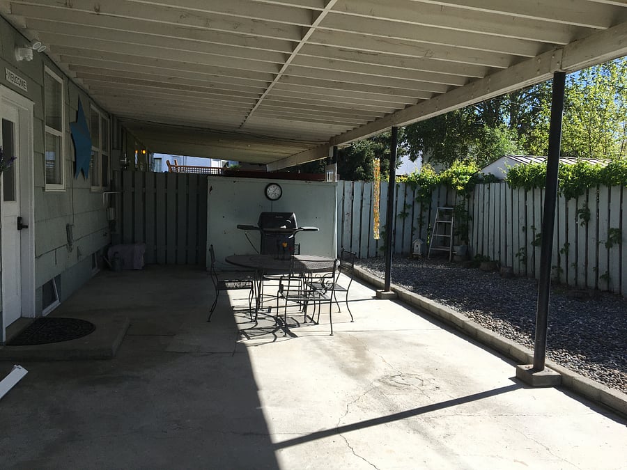 View of covered patio and rear entrance