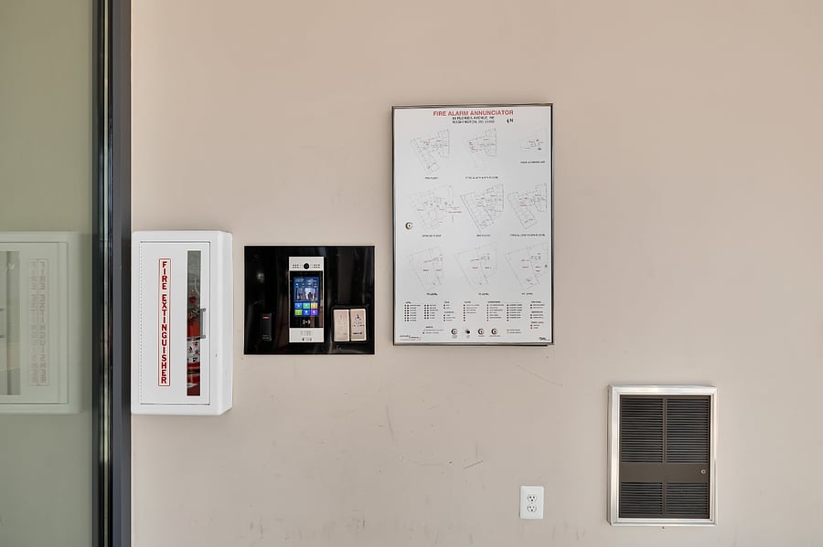 Cloud-based security panel in foyer into building lobby - access through SmartPlus mobile app