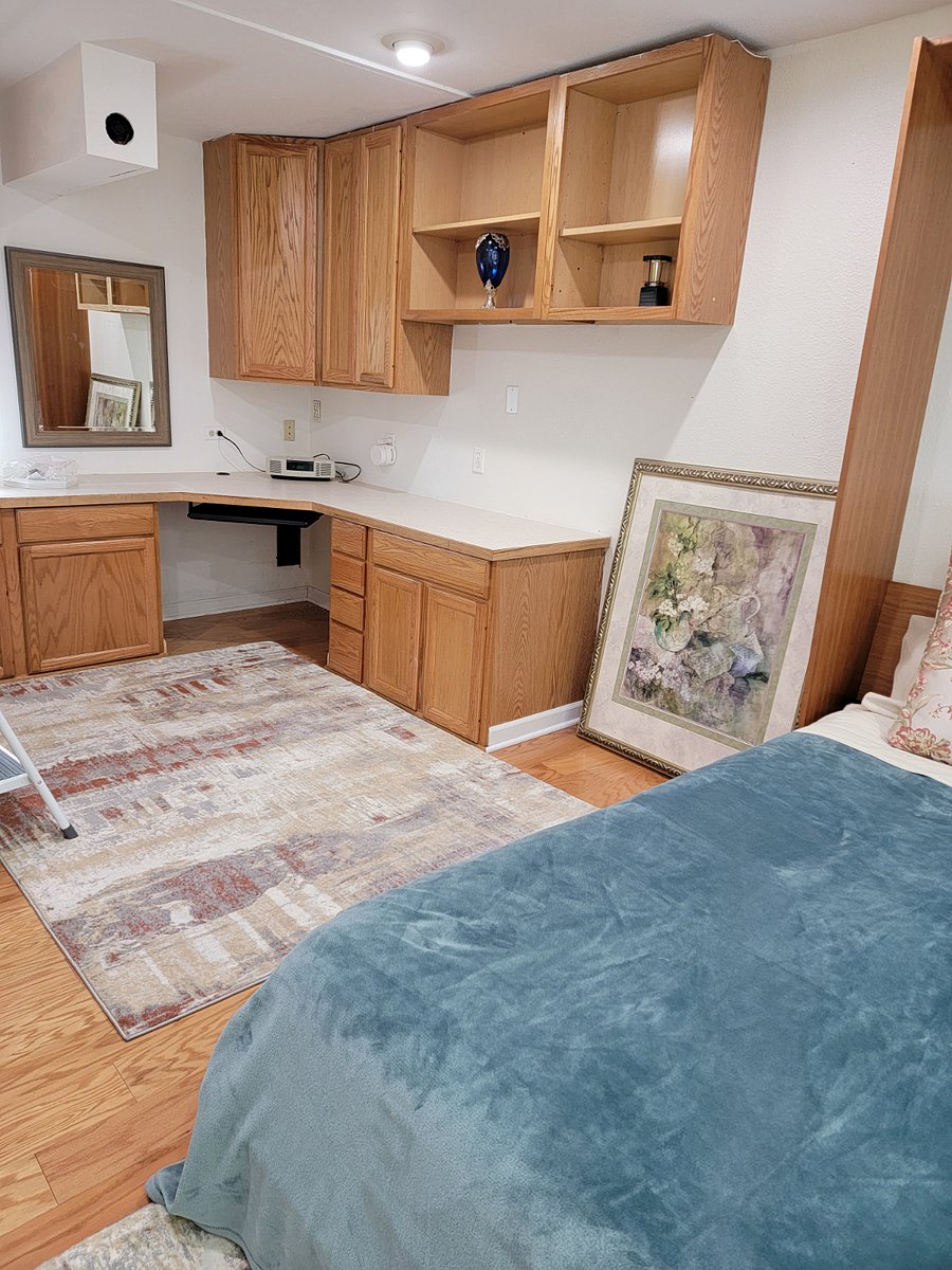 Bedroom with queen size bed and plenty of storage