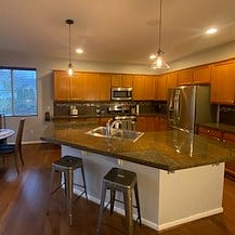 LARGE gourmet kitchen with gas appliances and stainless steel fridge/stove/microwave and dishwasher