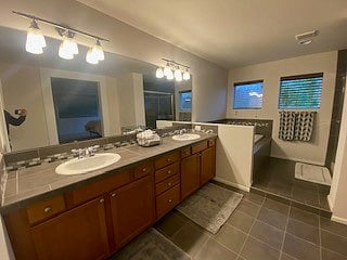 Primary bathroom with double sinks, soaking tub, shower and toilet