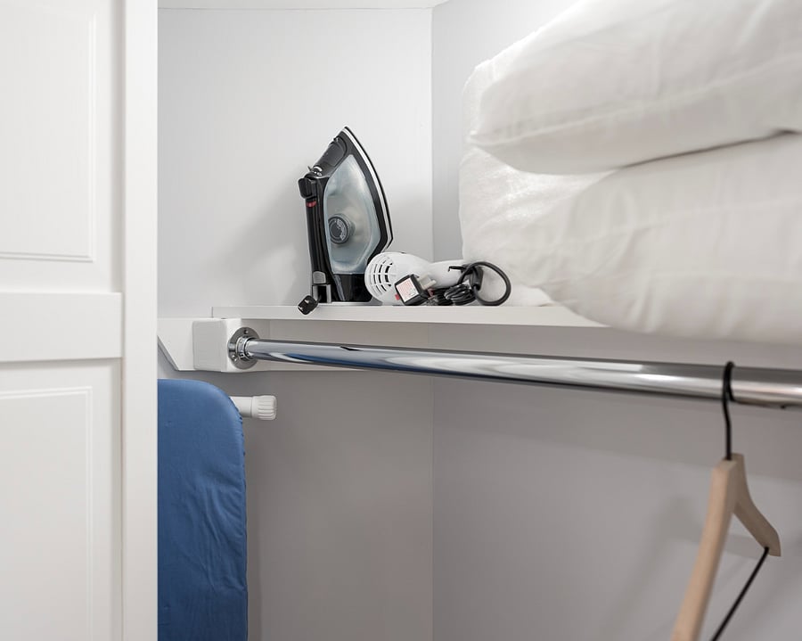 Closet Space With Storage, Ironing Board and Iron.