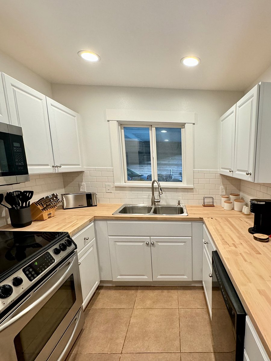 Large Kitchen with lots of prep space with hand made butcher block counters.