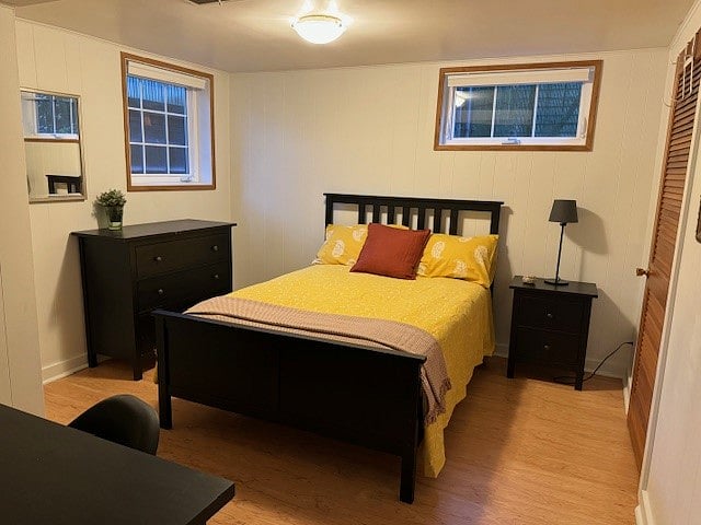 Large bedroom with full (double) bed, large desk, and walk-in closet.