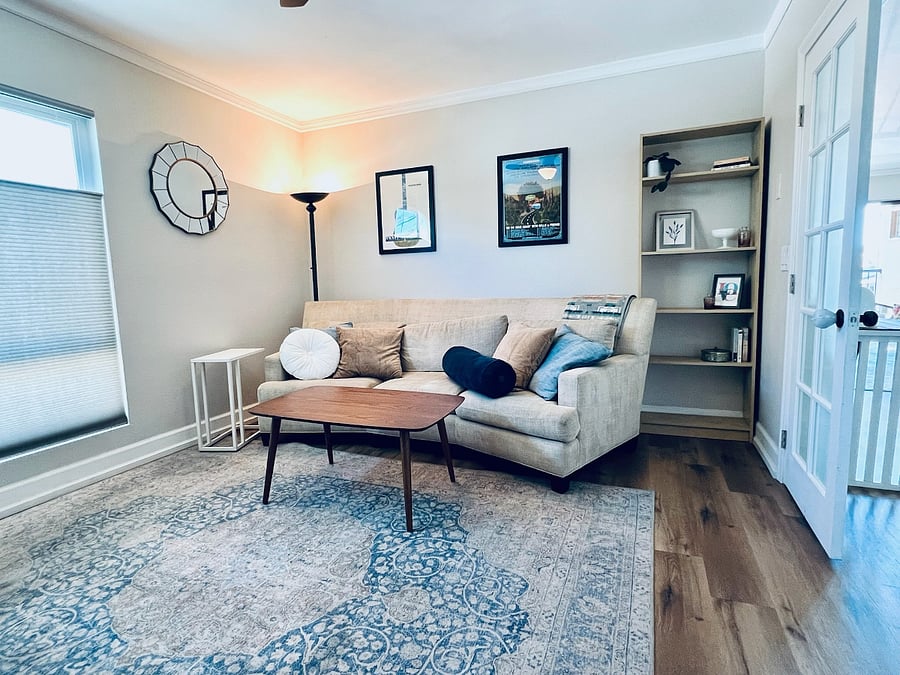 This room is currently set up as a bedroom with a full size bed and nightstands. Staging it as pictured is also an option.