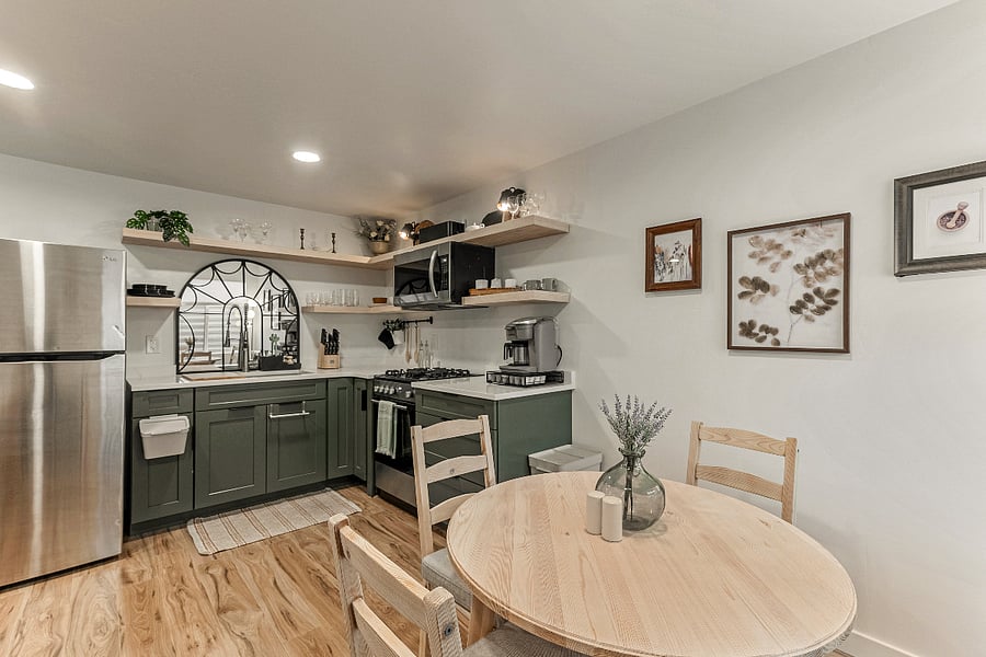 Kitchen - Cabinets and drawers are soft close and allow for easy storage. The kitchen also features a large stainless steel refrigerator. 
