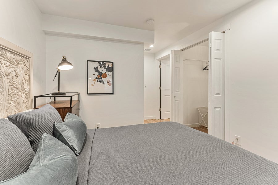 Blue Room - Features a large closet for storage and a workstation. 